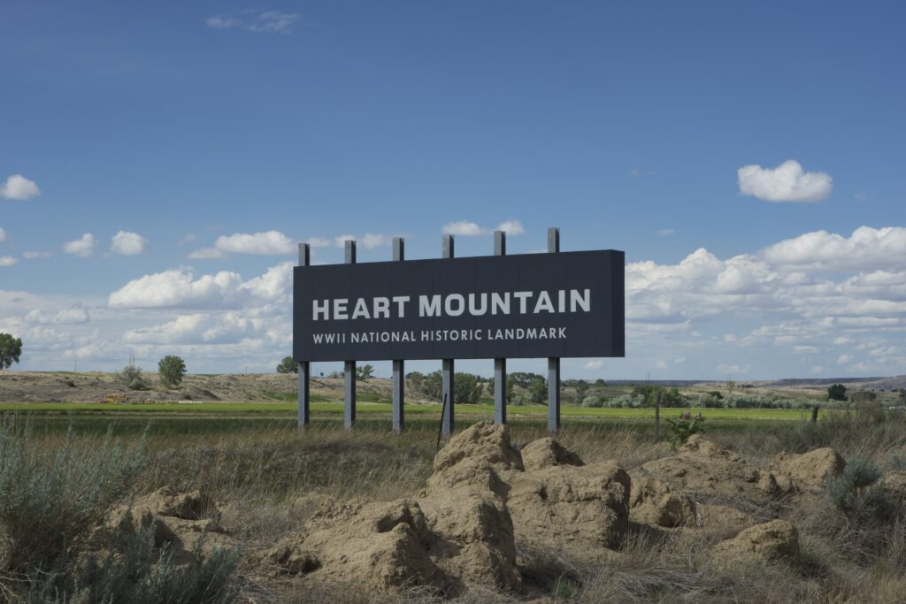 Sign that reads "Heart Mountain WWII National Historic Landmark"