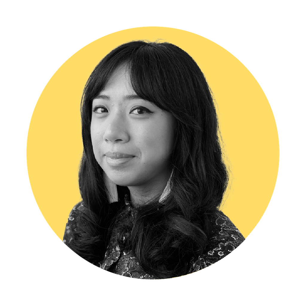 Headshot of Robin, black and white photo, yellow background, cropped in a circle shape.
